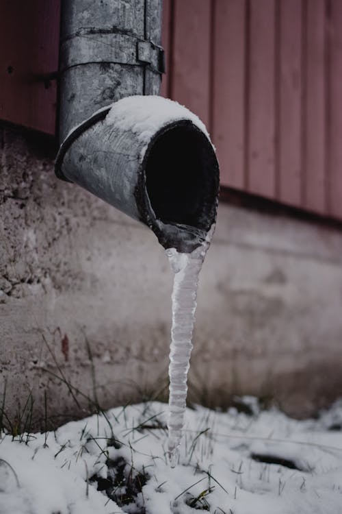 Frozen water on the drain spout