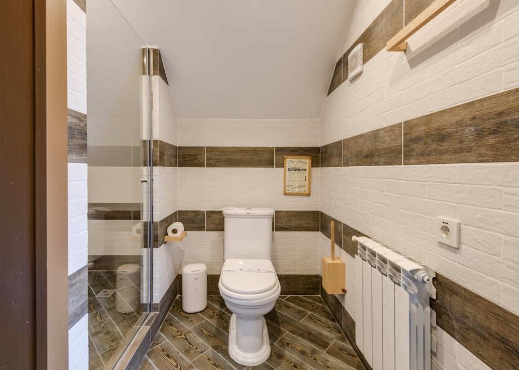 A toilet seat inside a bathroom