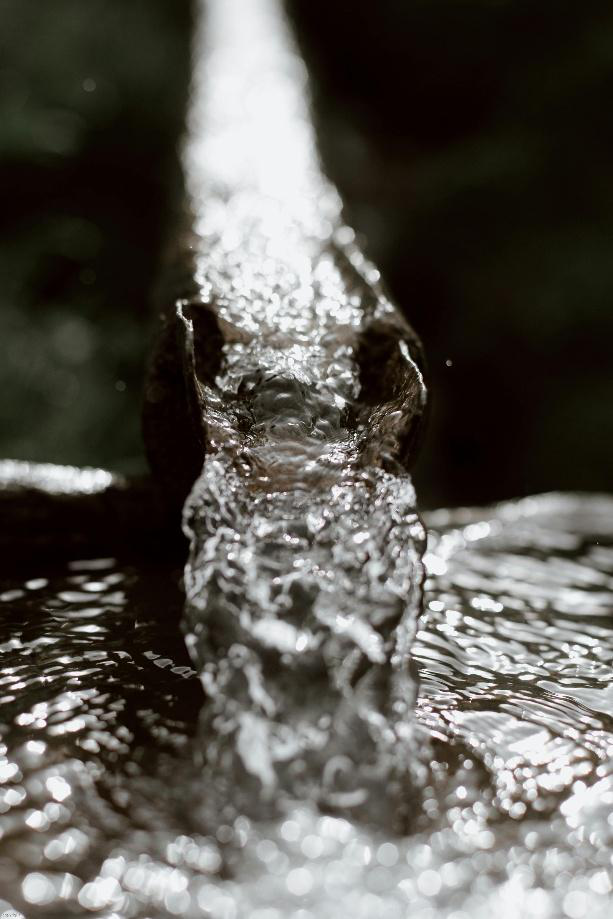 Water flowing through a narrow drainage channel