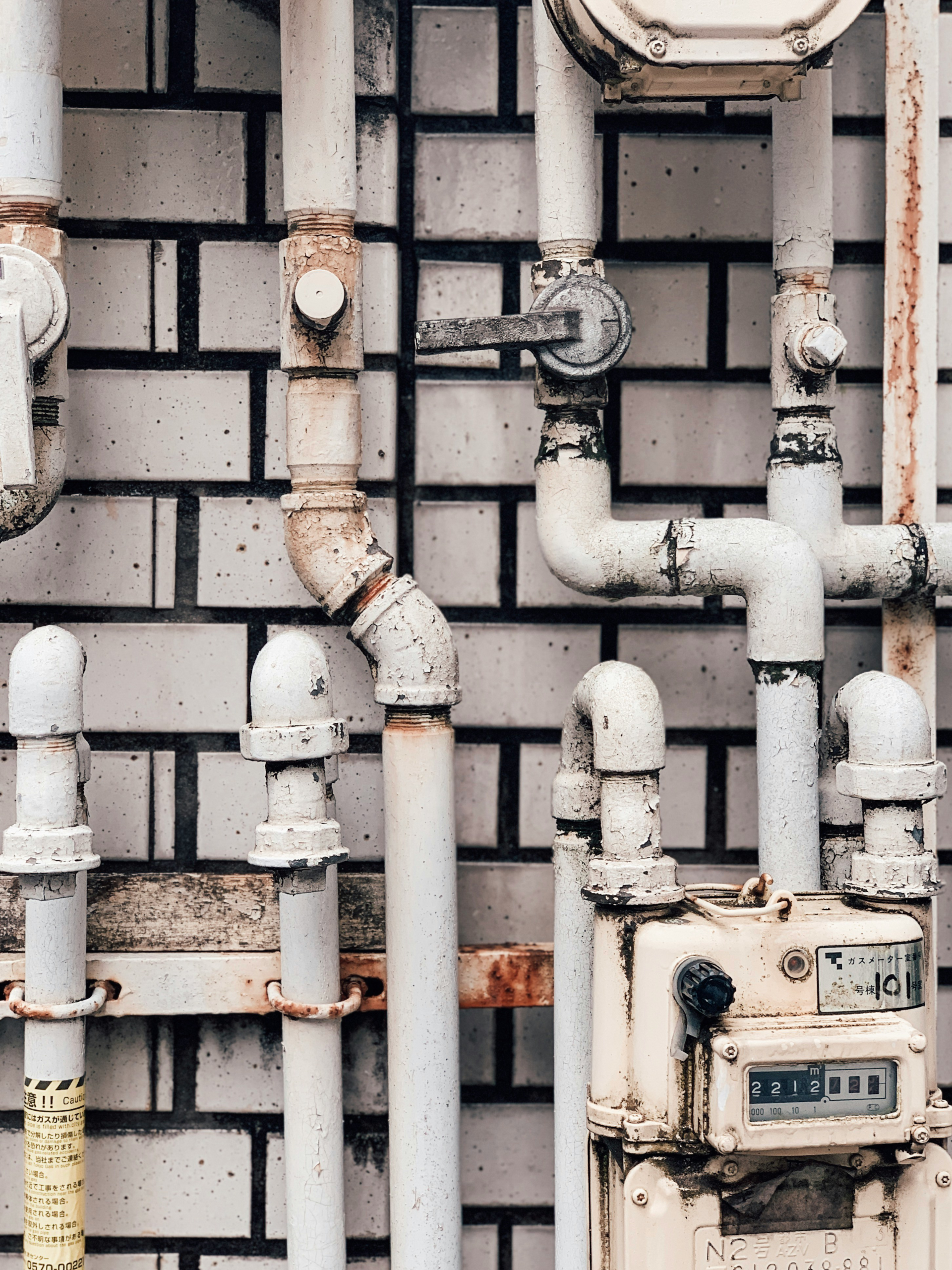 Residential water supply pipes connected to an analog water meter