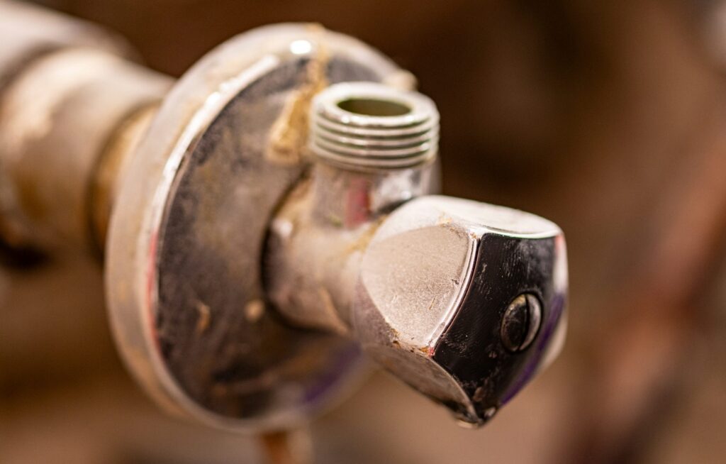 A close up of a water faucet with nozzles