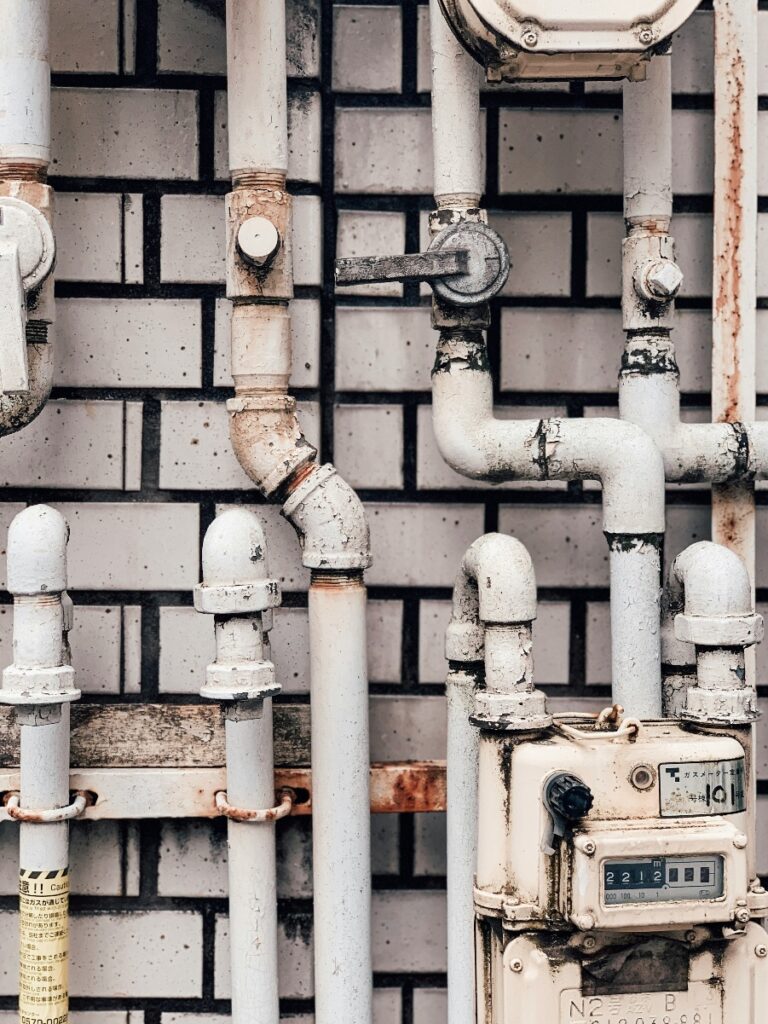 Residential water supply pipes connected to an analog water meter